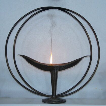 lit candle in chalice